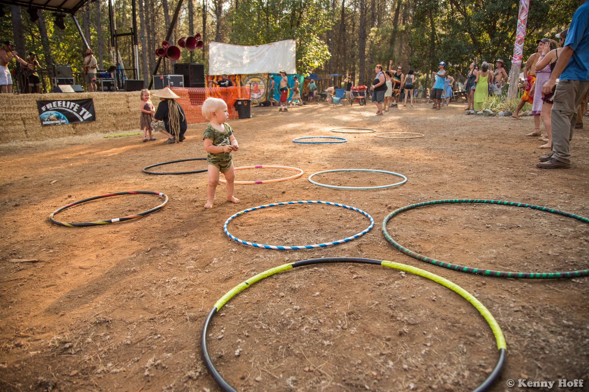 Children playing with hula hoops at Trinity Jamboree festival